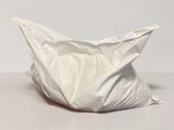 a white bag sitting on top of a table