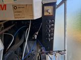 a close up of a machine with wires attached to it
