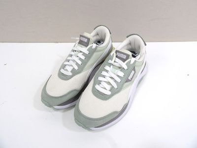 pair of white and grey sneakers with white laces on a white surface