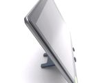 a tablet computer sitting on a stand on a white surface