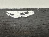 a black and white photo of a knife with a white heart on it
