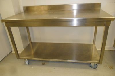a stainless steel work table with a sink on it