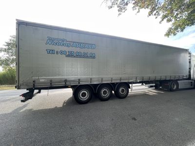 a semi truck that is parked on the side of the road