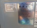 a close up of a white refrigerator with a label on it