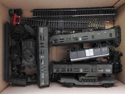 a box with a bunch of toy trains inside of it