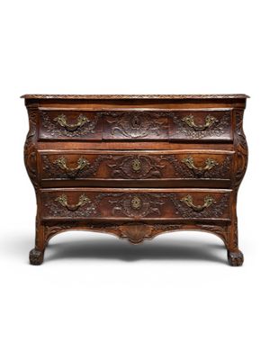 an old wooden chest of drawers with ornate carvings