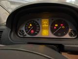 a close up of a car dashboard with a speedometer and gauges