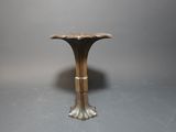 an image of a small table with a flower design on the top