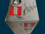 a box of legos sitting on a blue surface