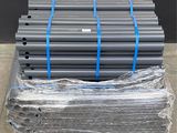 a pile of pipes sitting on top of a pallet