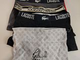 four men ' s lacoste boxers in various colors and patterns