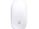 a white apple mouse sitting on top of a white surface