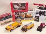 a lot of toy vehicles that are sitting on a table