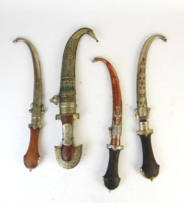three different types of knifes are displayed on a white surface