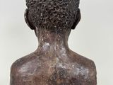 a close up of a sculpture of a head on a white background