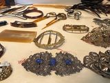 a table with many different types of jewelry on it