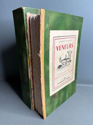 an old green book with a picture of a dog on it