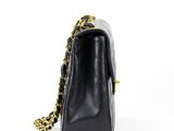 a black chanel bag with gold chain