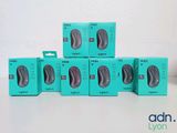 four boxes of blue and black computer mouses sitting on a white surface