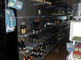 many bottles of wine on the shelves in the store