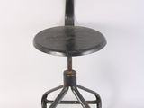 an image of a black stool with a wooden seat on a white background
