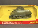 the toy tank is in the box on the table