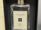 a close up of a bottle of perfume in a box