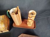 three wooden items that are sitting on a table