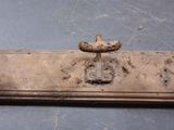 a rusted metal door handle on a metal door