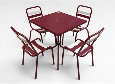 four chairs and a table on a white background