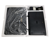 a box with a laptop inside of it on a white surface