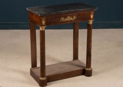 a small wooden table with a marble top on it