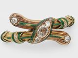 an image of a green and gold broochle with diamonds
