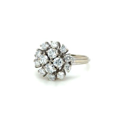 an image of a diamond cluster ring on a white background