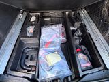 a trunk of a car with a bunch of items in it