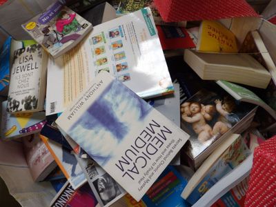 a pile of books sitting on top of a table