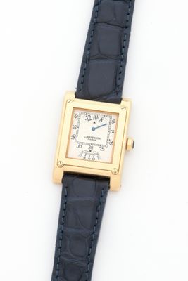 an image of a close up of a wrist watch on a white surface