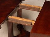 a wooden table with a drawer underneath it