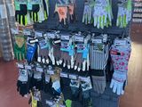 display of gardening gloves and gloves for sale in a store