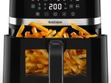 a close up of an air fryer with french fries in it