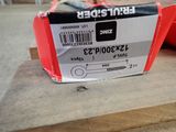 a box with a label on it sitting on a piece of wood