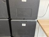 several boxes are stacked on top of each other in a room