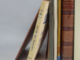 several books are stacked on top of each other on a table