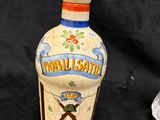 a small bottle with a picture of a man on it