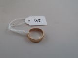 a gold ring with a price tag attached to it