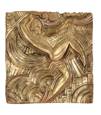 an image of a gold sculpture of a man sitting on top of a table