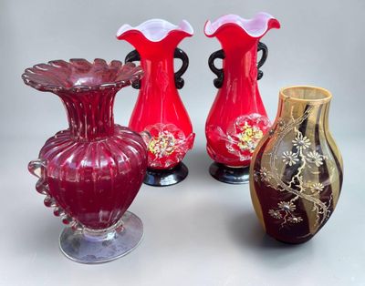 four vases that are sitting on a table