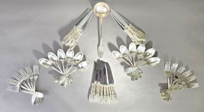 a lot of spoons and forks hanging from the ceiling