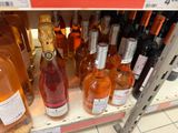 many bottles of wine on the shelf in the store