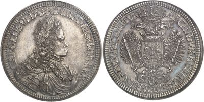 a close up of two silver coins on a white background
